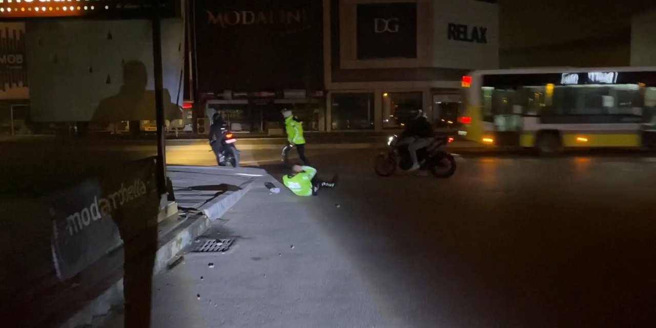 İhtara uymadı, kendisini durdurmaya çalışan polisi yere düşürdüğünü sosyal medyadan paylaştı